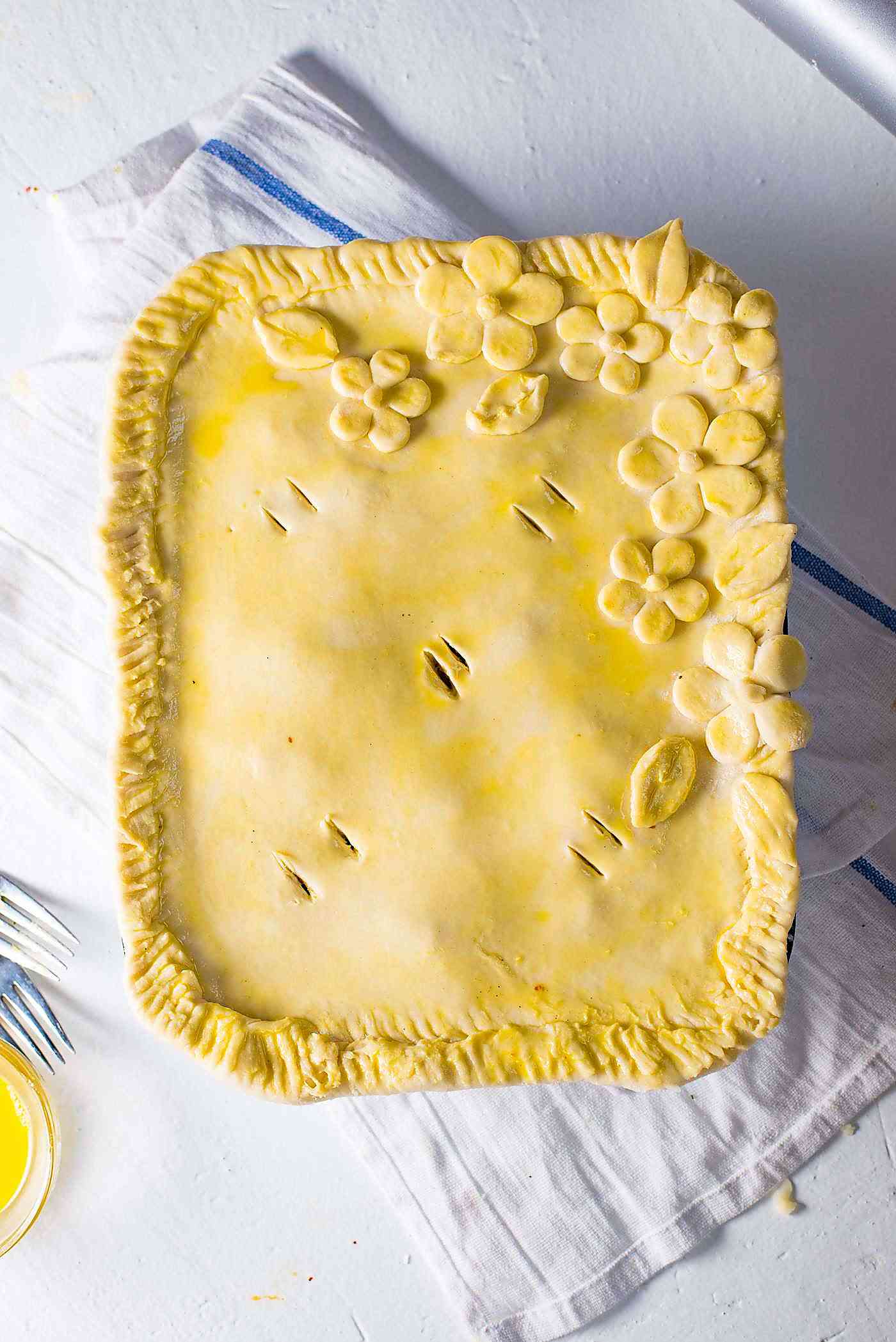 Ultimate Bacon and Egg Pie - Use extra puff pastry to create a design on top. Be creative and have fun with the designs, and don't forget the egg wash to make the crust shine. 