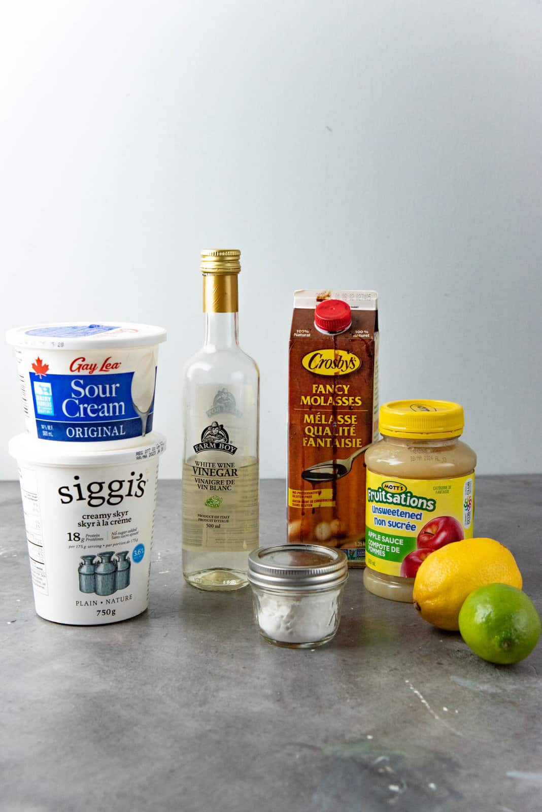 A few types of acids that can be added to recipes, including yogurt, sour cream, vinegar, cream of tartar, molasses, applesauce, and citrus.