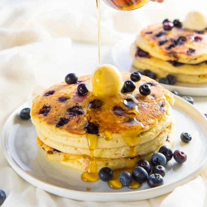 Fluffiest Blueberry Pancakes - Delicious blueberry pancakes to start the day with juicy and sweet blueberries. Make them with a pancake mix or from scratch, but either way will be fluffy and amazing. 
