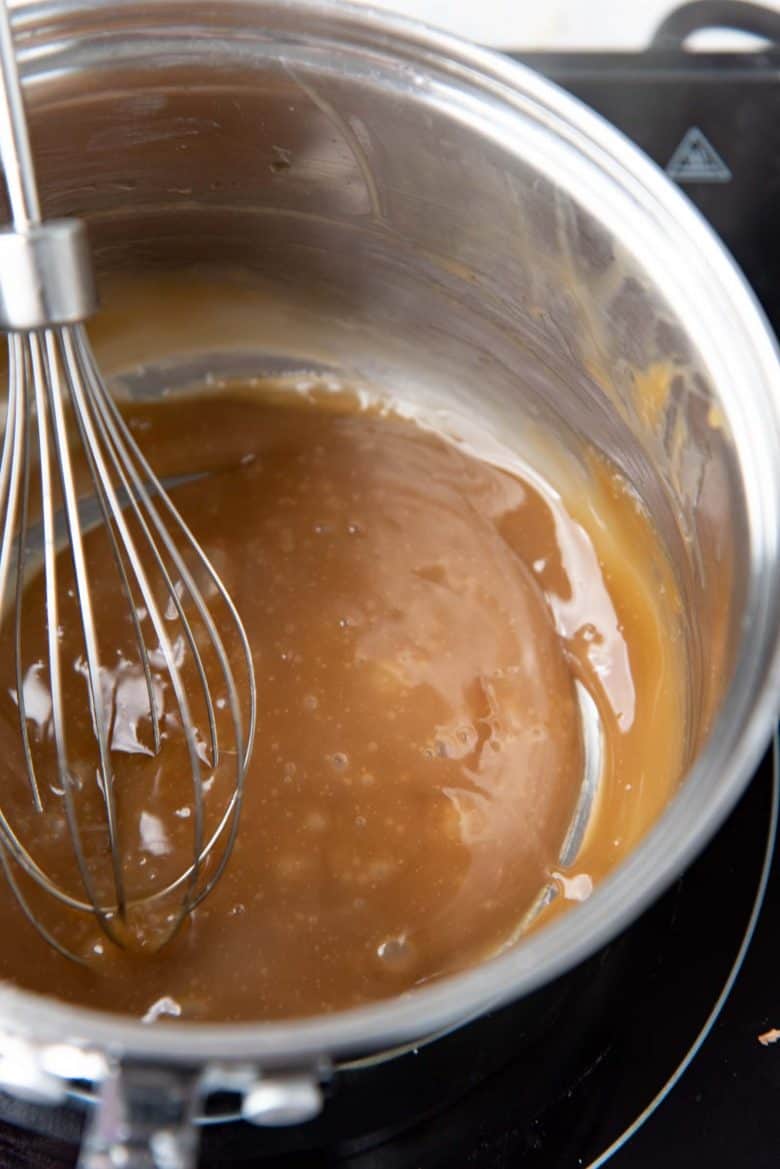 Tapioca starch thickening in a saucepan to make the starter dough for boba pearls