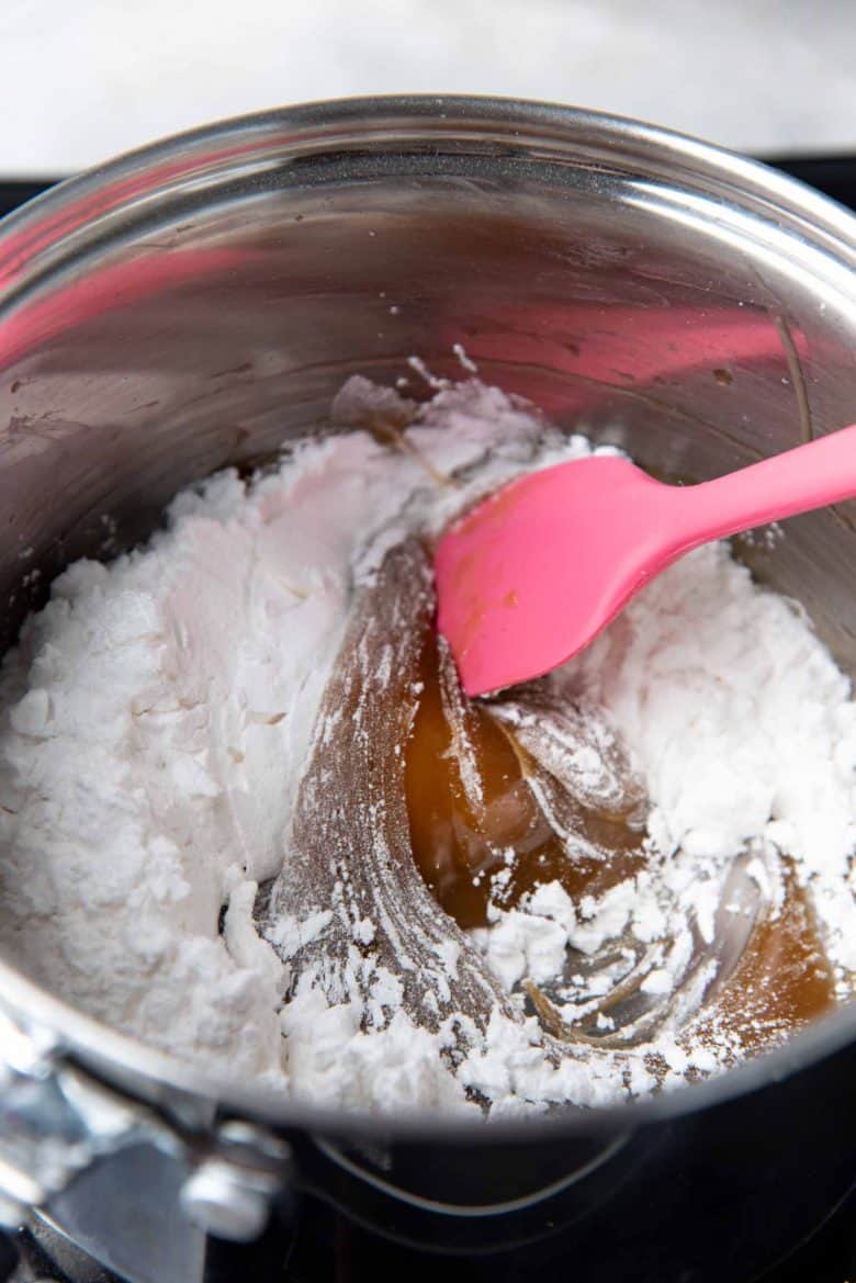 Mixing in the rest of the tapioca starch into the starter dough
