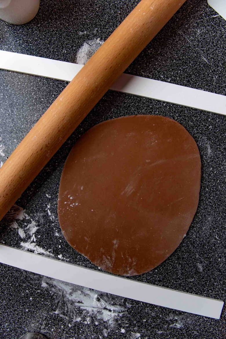 Rolling out the cooled dough on a work surface