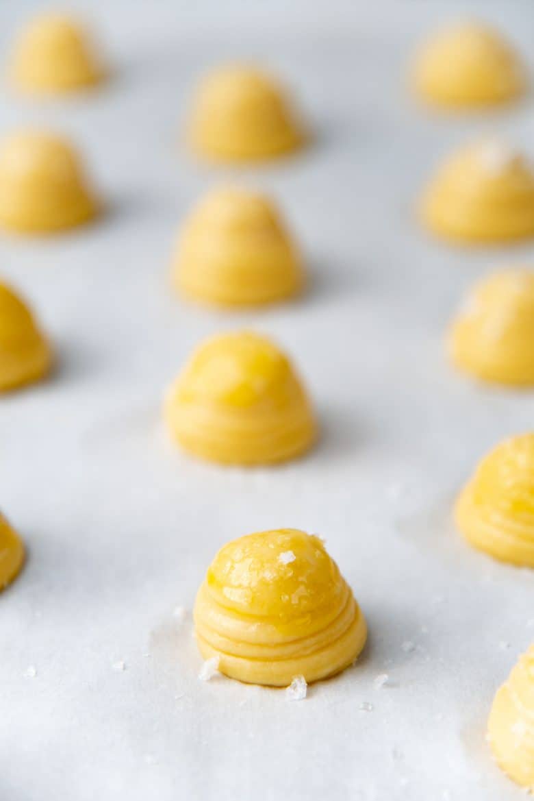 Salt sprinkled on top of the choux pastry