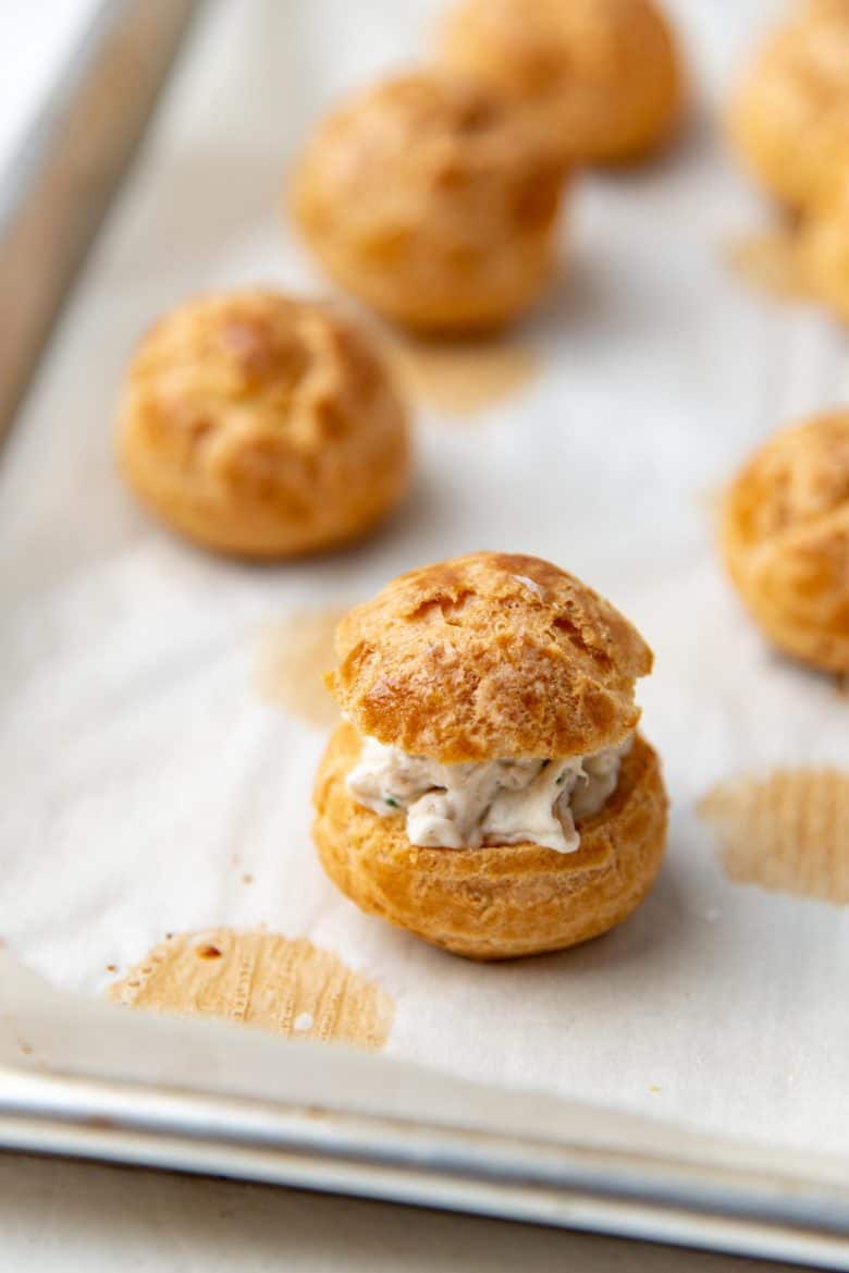 The tops of the pastry placed back on top of the chicken puff