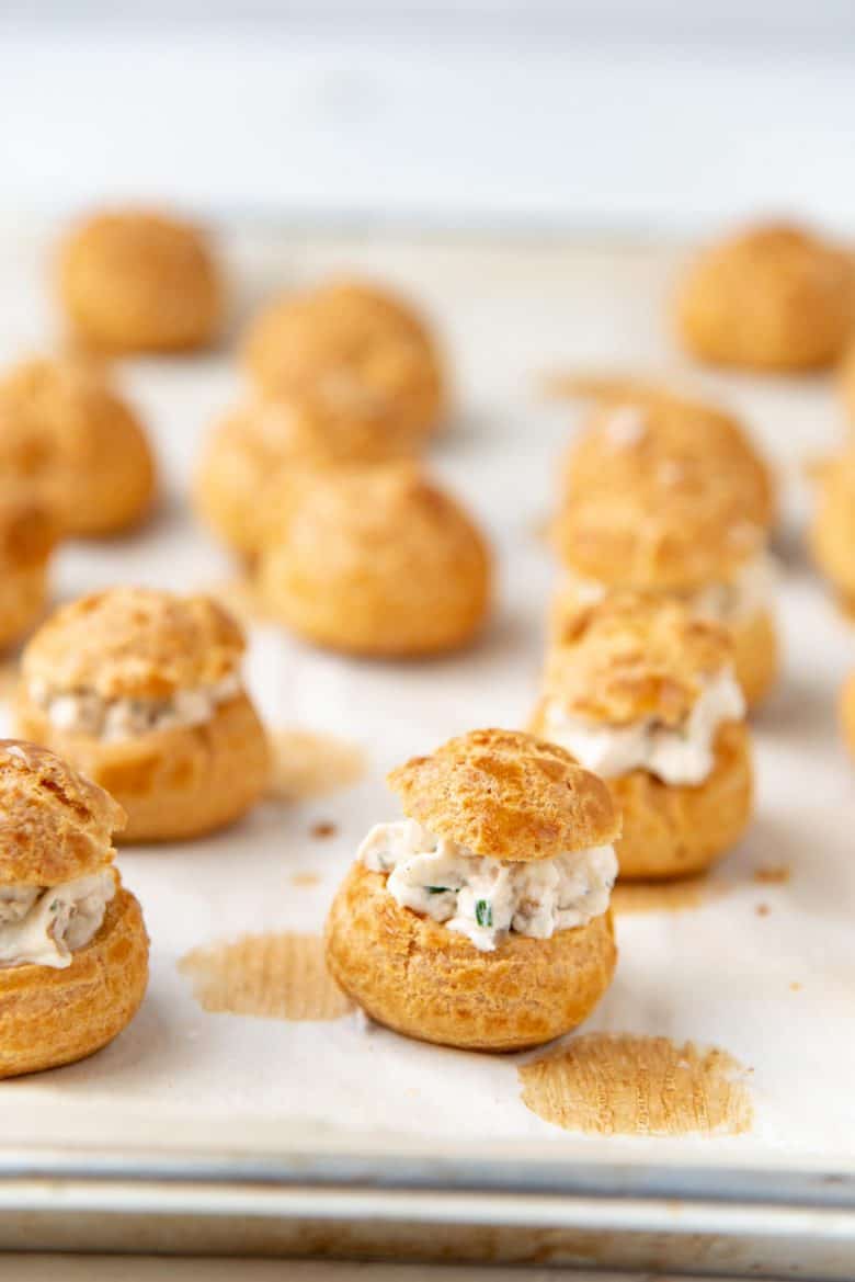 All chicken puffs on a lined baking tray