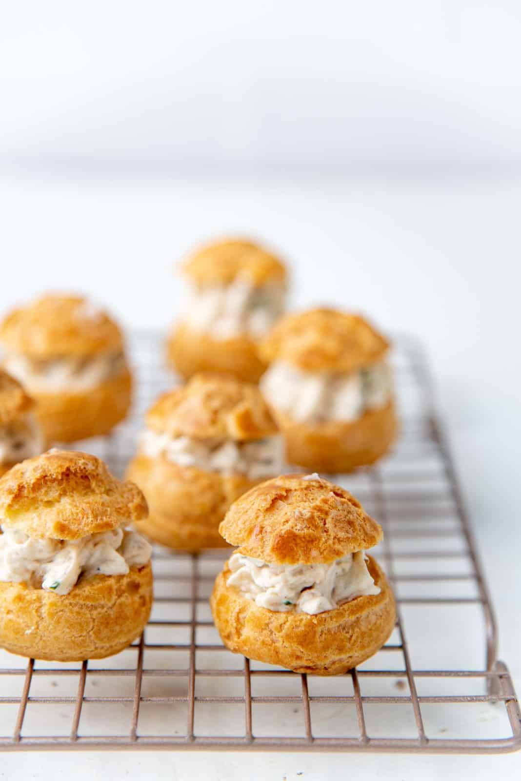 The chicken filled choux pastry on a wire rack