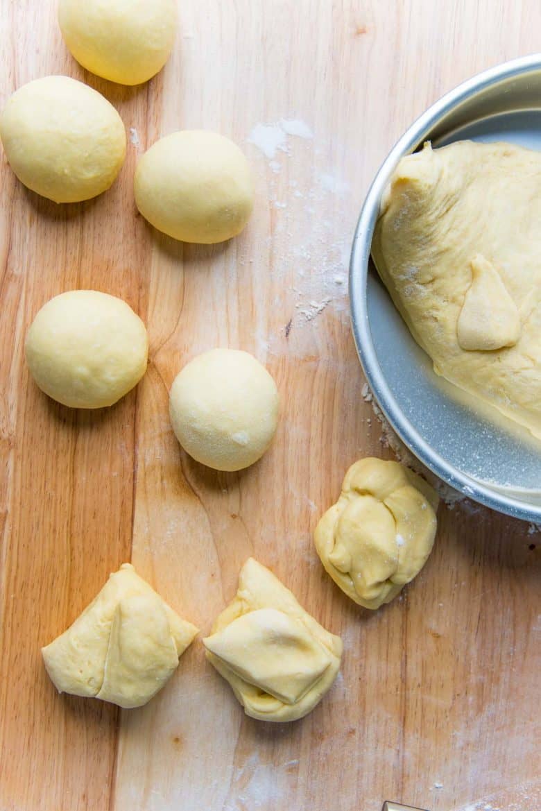 Portioning the dough into 8 equal portions to make a nantaise brioche loaf.