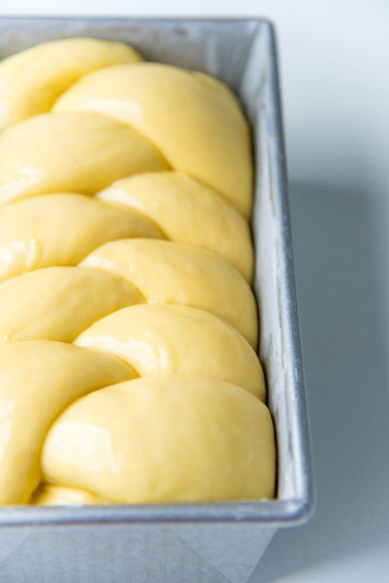 Properly proofed brioche bread dough in a loaf pan. 