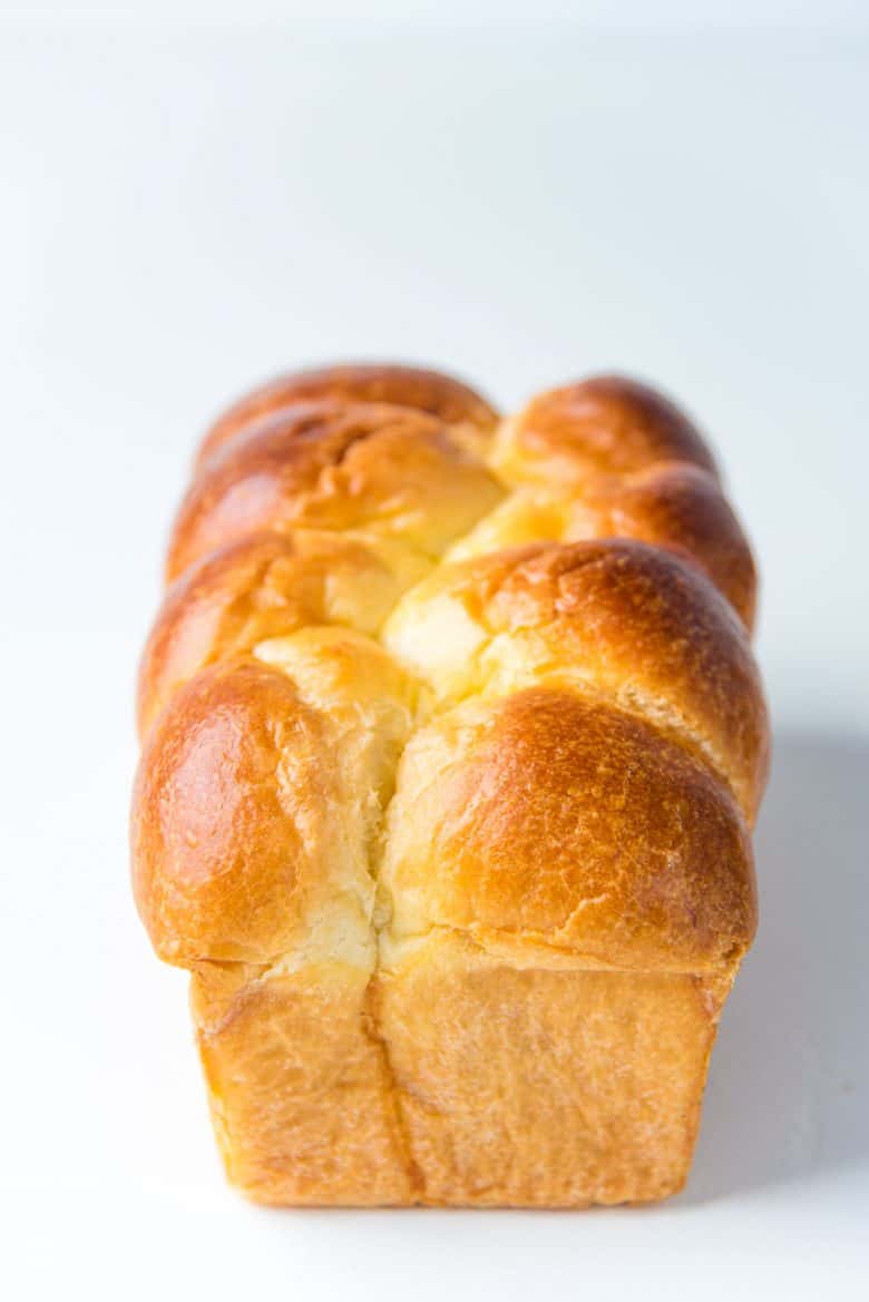 A perfectly baked brioche bread loaf shaped in the Nantaise method.