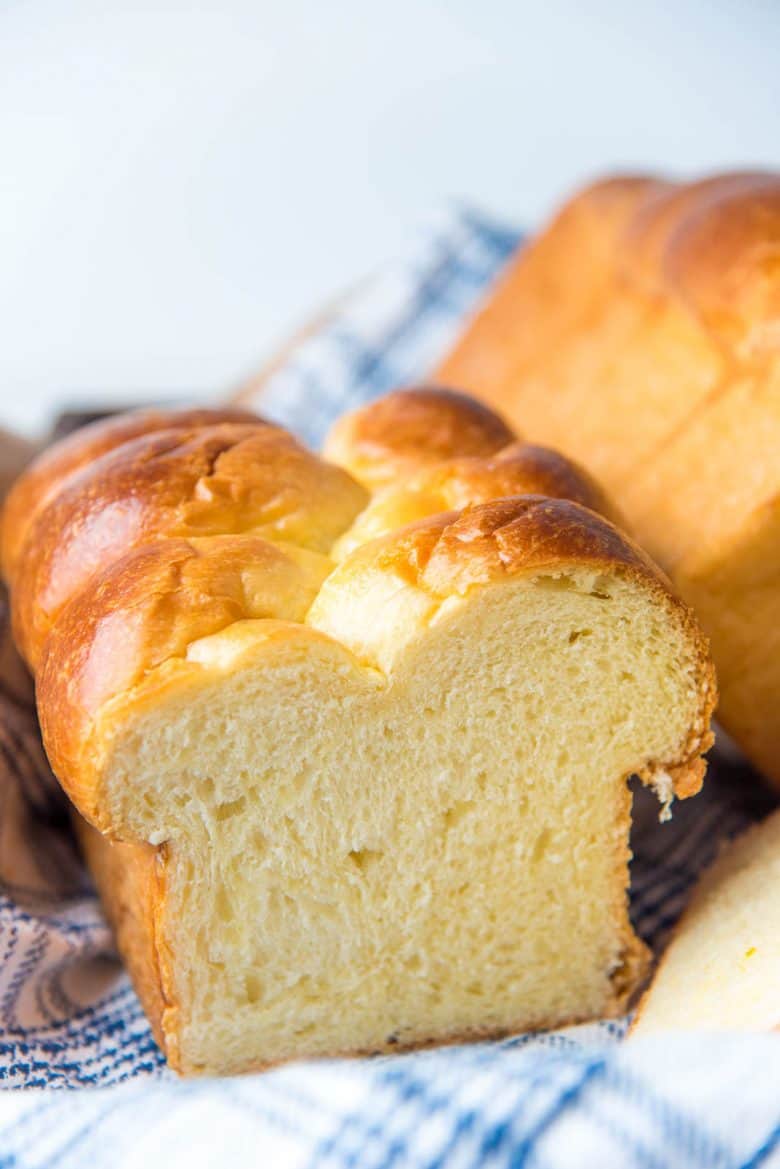 Cross section of a baked brioche bread loaf showing the perfect crumb.