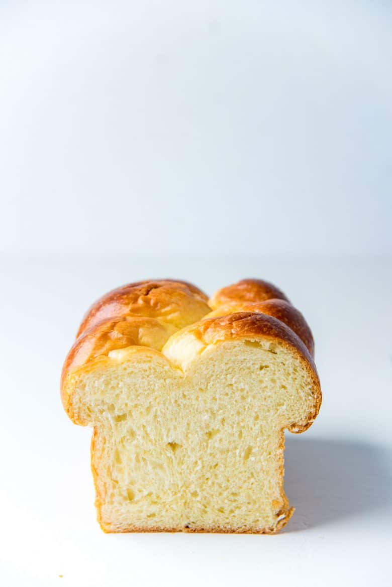 Cross section of a fully baked brioche bread loaf to show the crumb.