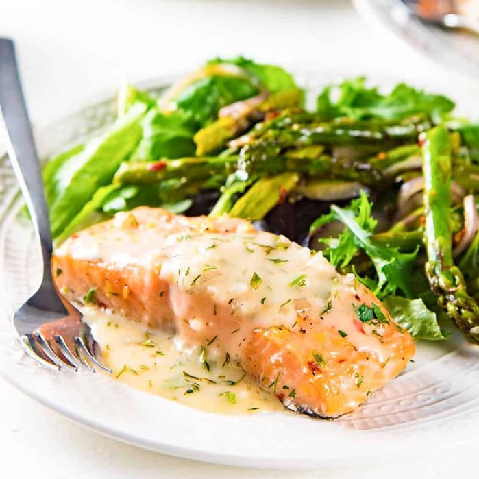 Buttery Lemon Slow Roasted Salmon with Lemon Butter Sauce - Perfectly cooked, juicy slow roasted Salmon with a buttery tangy sauce! Delicious and versatile for any meal and occasion. 