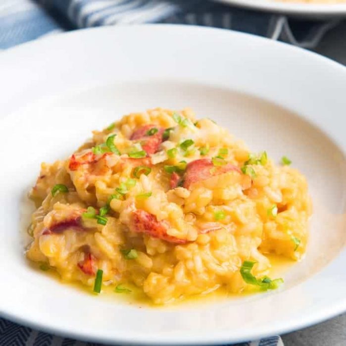 Butter Lobster Risotto - Elegant, delicious and creamy lobster risotto, with chunks of butter poached lobster and a drizzle of brown butter. Perfect romantic meal for two or for guests at a dinner.
