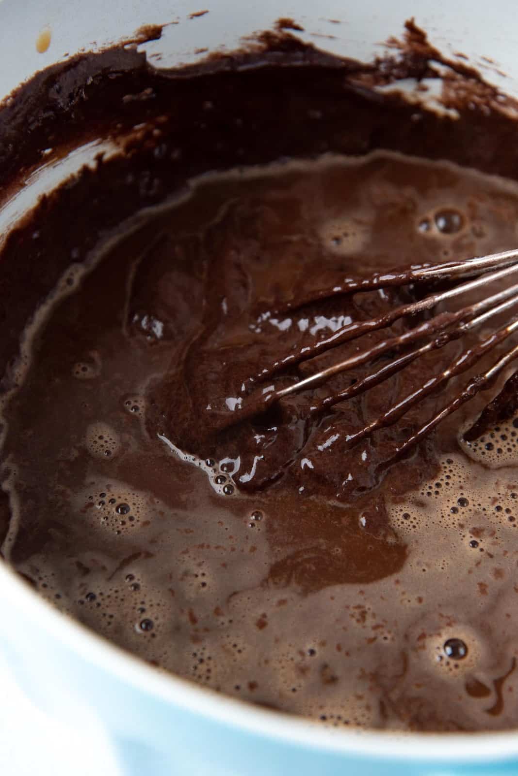Adding hot water to the cake batter