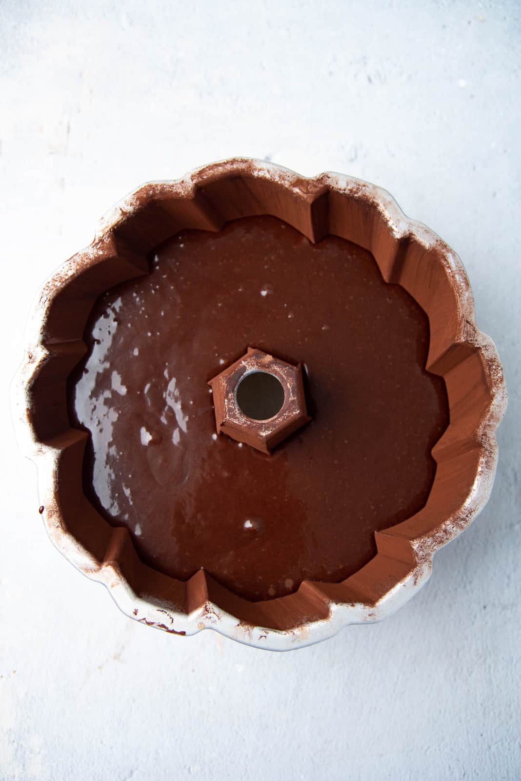 Cake batter in a bundt cake pan.