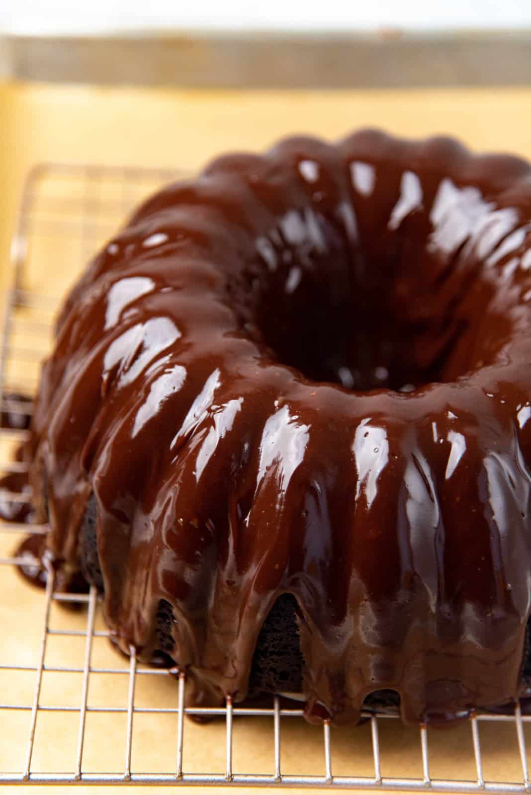 Chocolate glaze poured over the cooled chocolate bundt cake