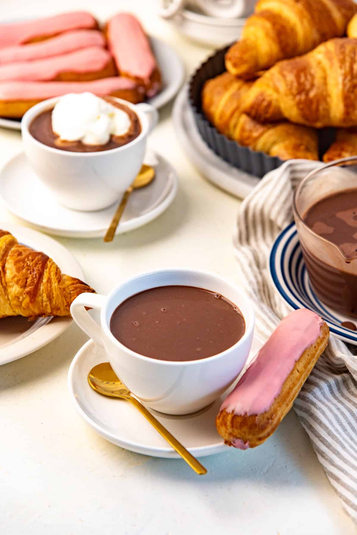 Two coffee cups with saucers, filled with thick French hot chocolate.