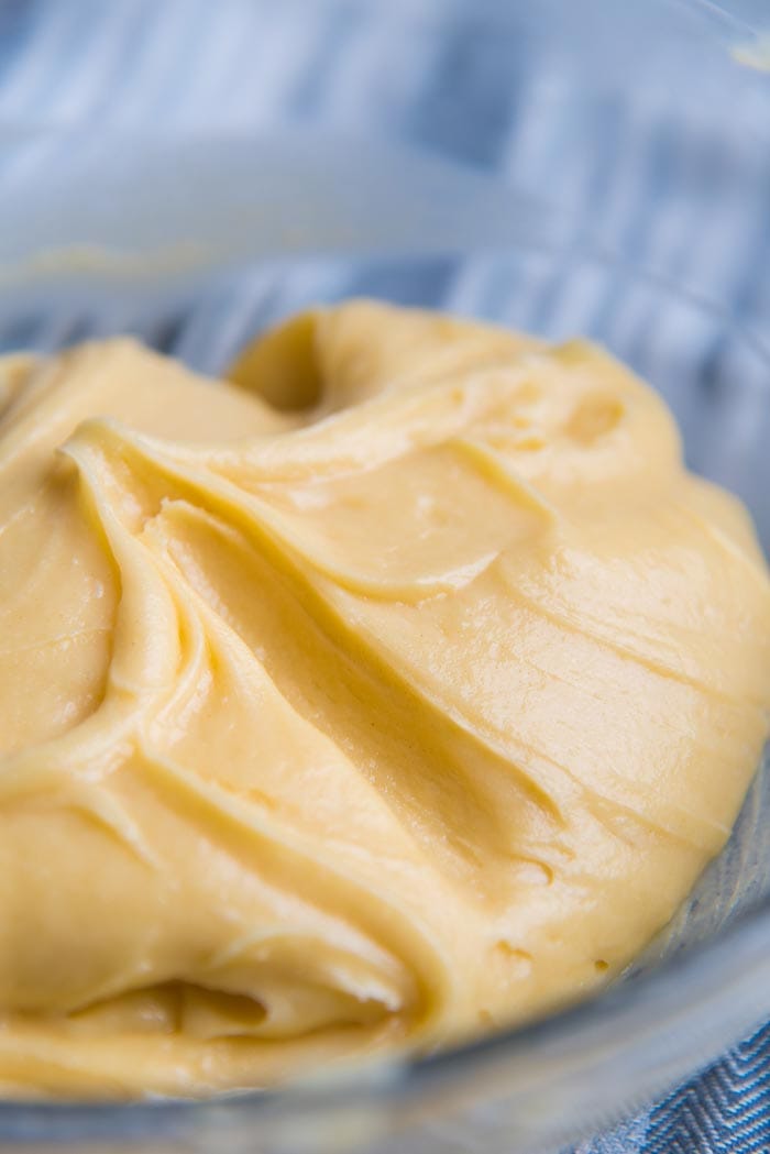 How to tet for the right consistency for choux pastry - Finger test - make sure the sides of the trough doesn't fall into the trough.