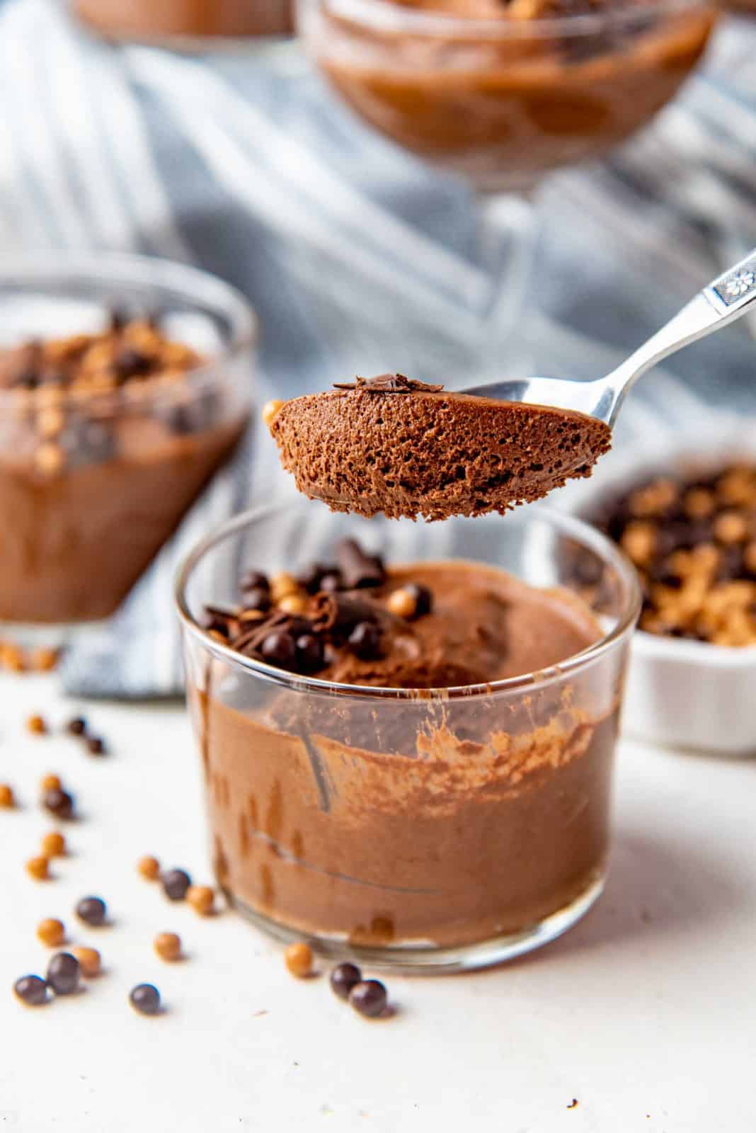 A spoonful of chocolate mousse taken from the dish, showing the airy texture.