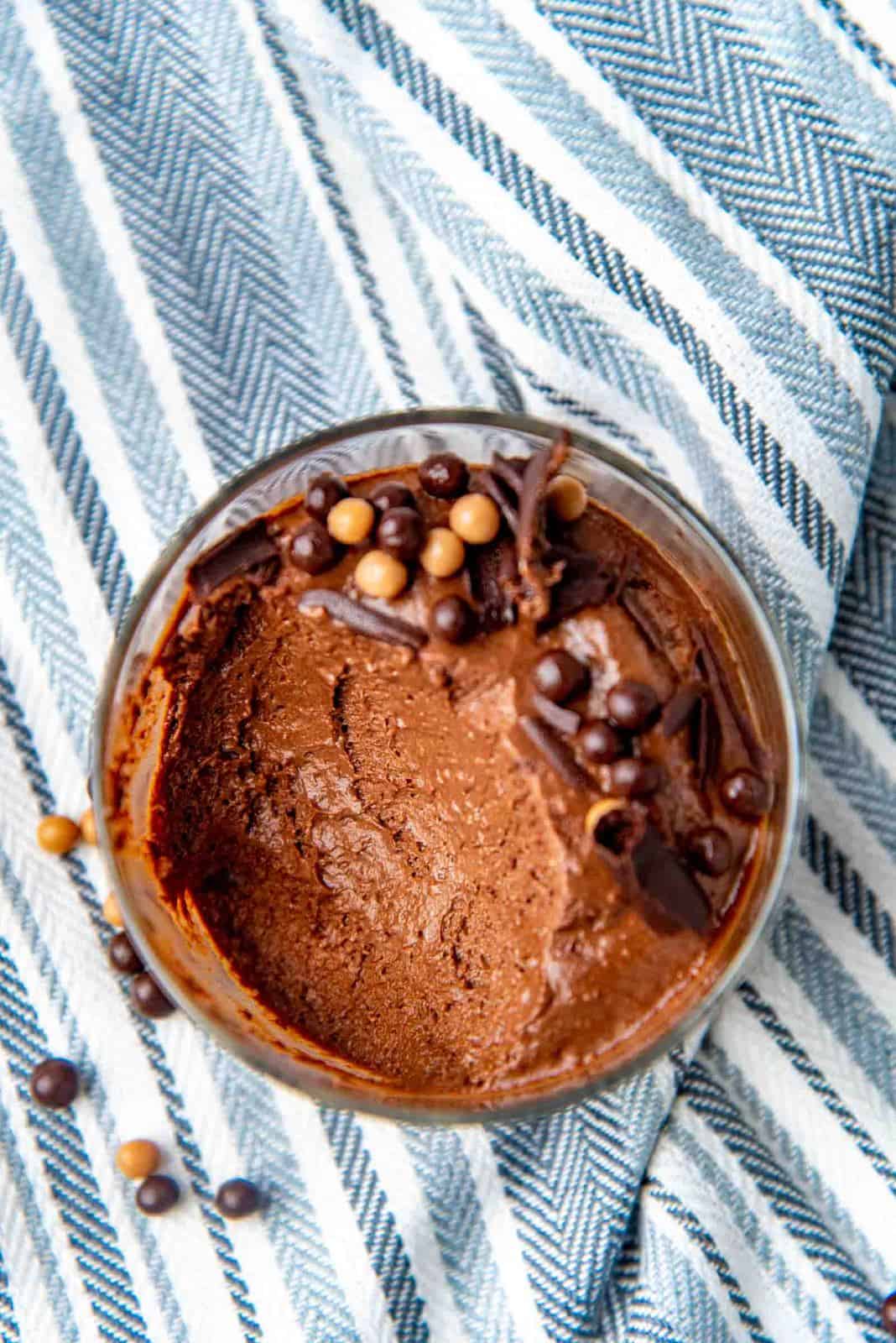 An overhead view of a half eaten chocolate mousse