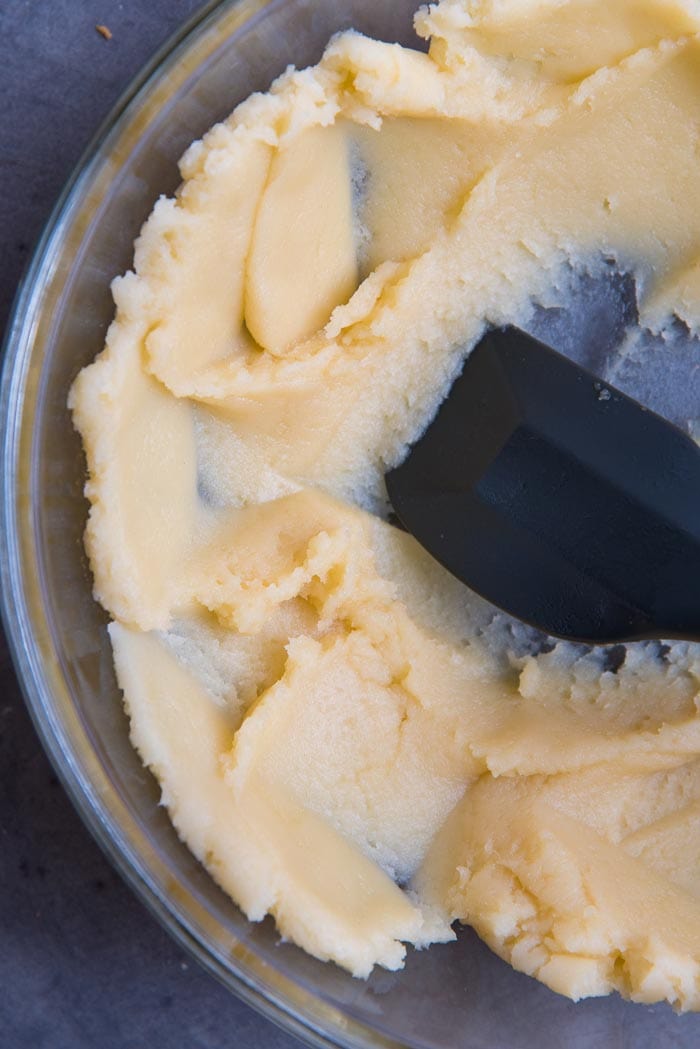Making perfect choux pastry - Spread the choux dough along the sides of the bowl to cool down faster and allow excess water to evaporate.