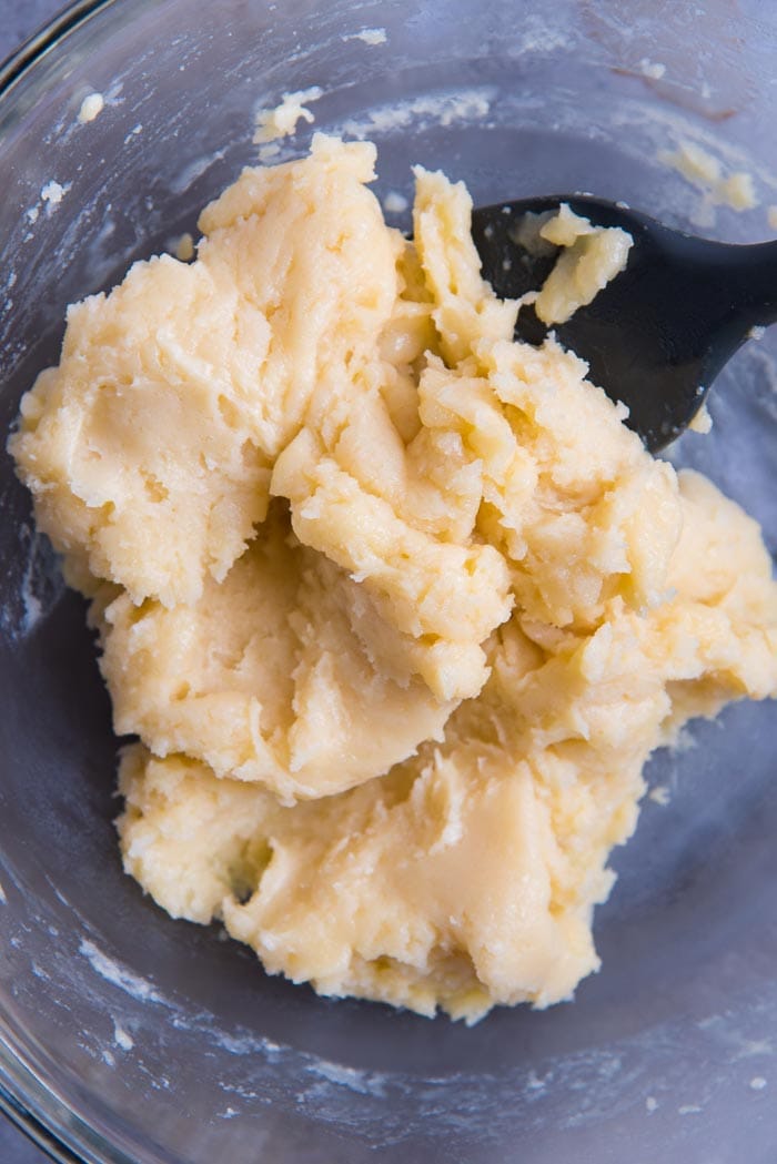 Making perfect choux pastry - Dry choux pastry dough, while mixing eggs.