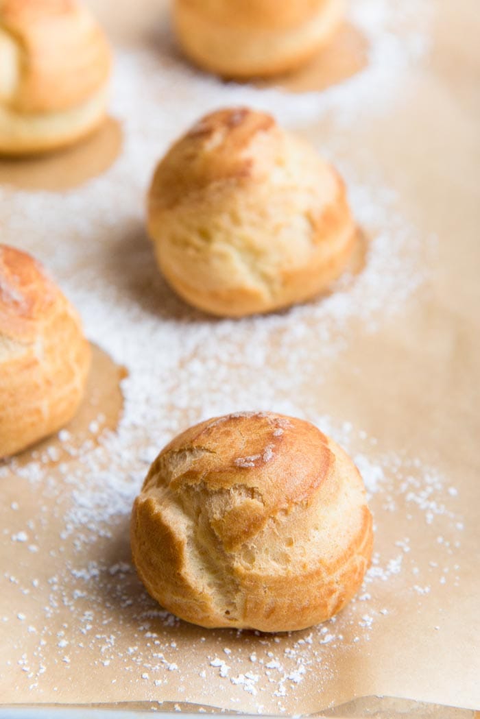 Learn how to make Perfect Choux Pastry (Or Pâte à Choux!) - The only recipe guide you will ever need to make choux pastry, with perfect results every time. Plus a troubleshooting guide for your choux pastry recipe. Fool proof choux pastry to make profiteroles, eclairs, cream puffs and more.