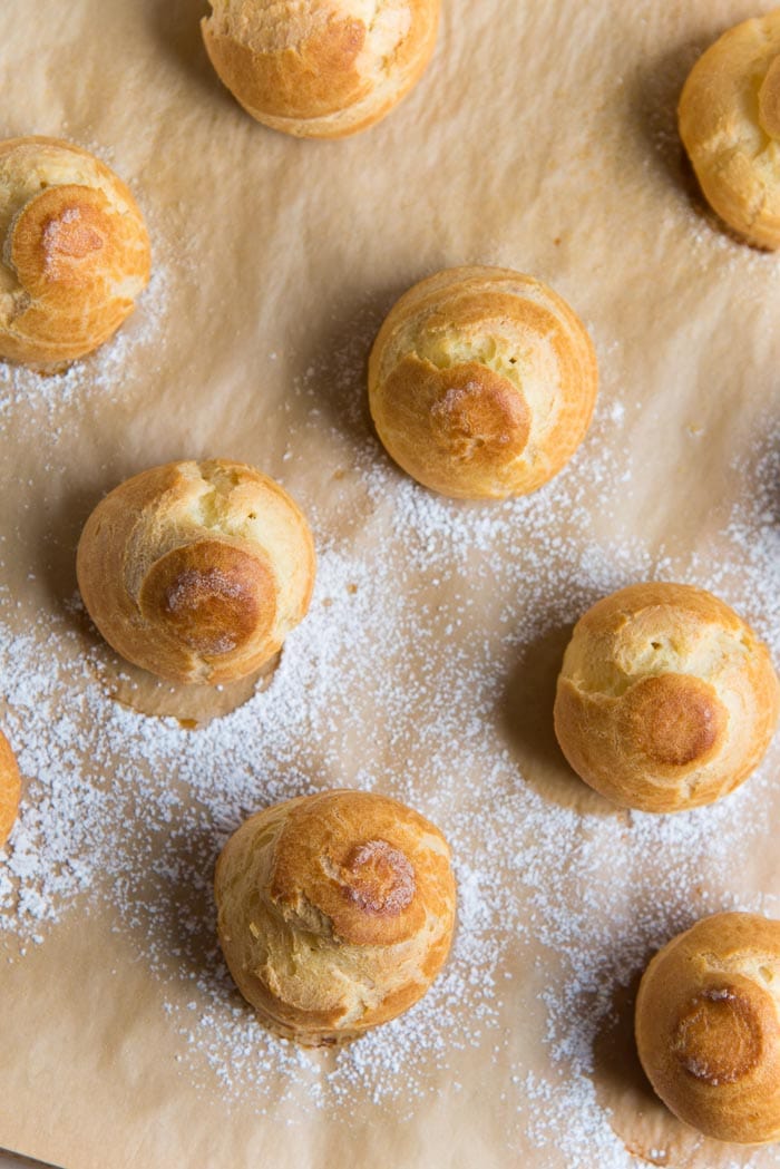 An overhead view of perfect;y baked choux pastry cases. 
