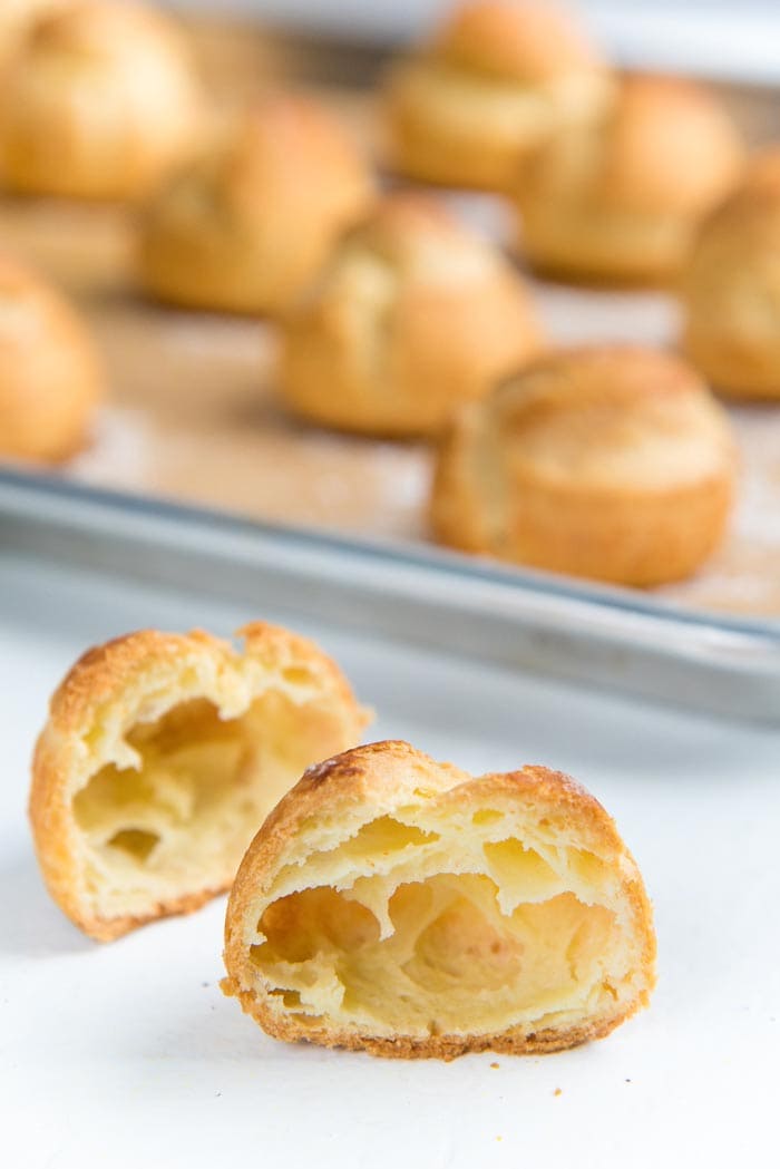 Inside of choux pastry. Choux pastry cut in half to show the airy pocket in the middle of the pastry cases.