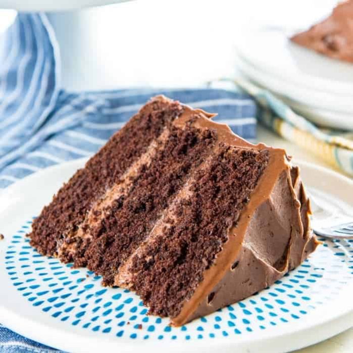 This Classic Chocolate Cake is the only AND the best chocolate cake recipe you will ever need! It has layers of soft, airy chocolate cake, with a creamy, buttery, melt in your mouth, chocolate buttercream frosting. Perfect cake for birthday cake, or any occasion!