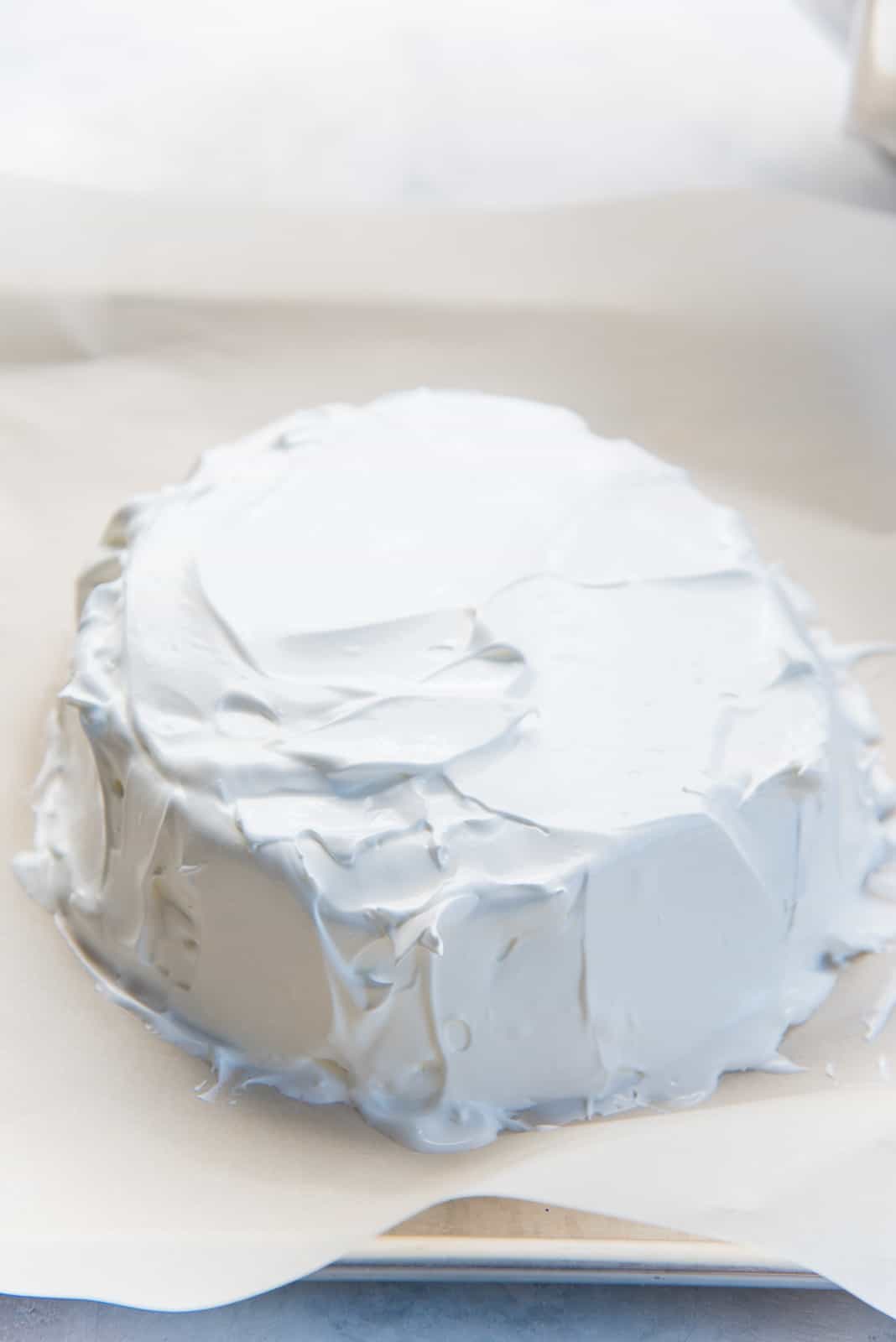 How to make pavlova - Shape the meringue within the drawn circle on the parchment paper.