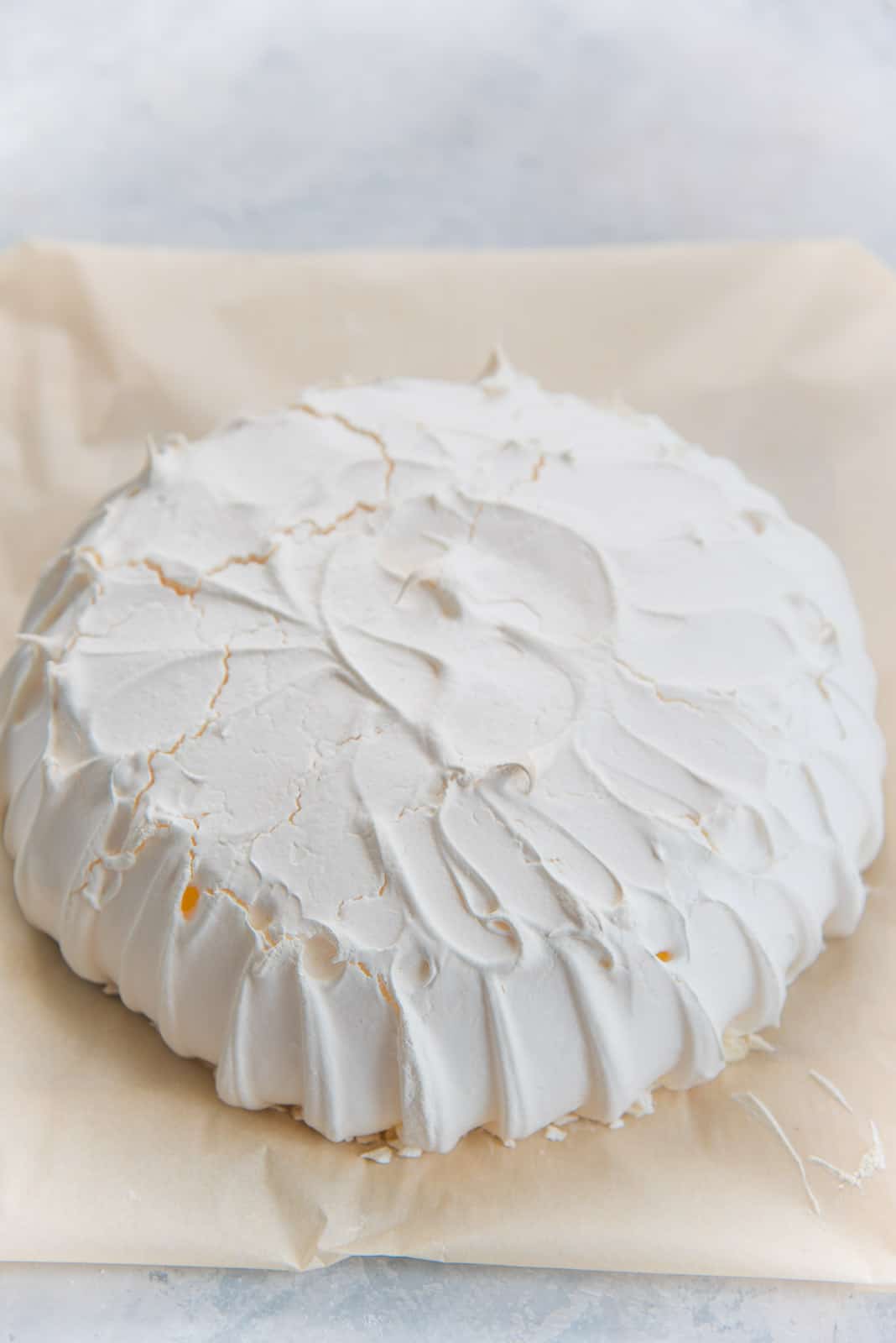A full view of a baked pavlova base