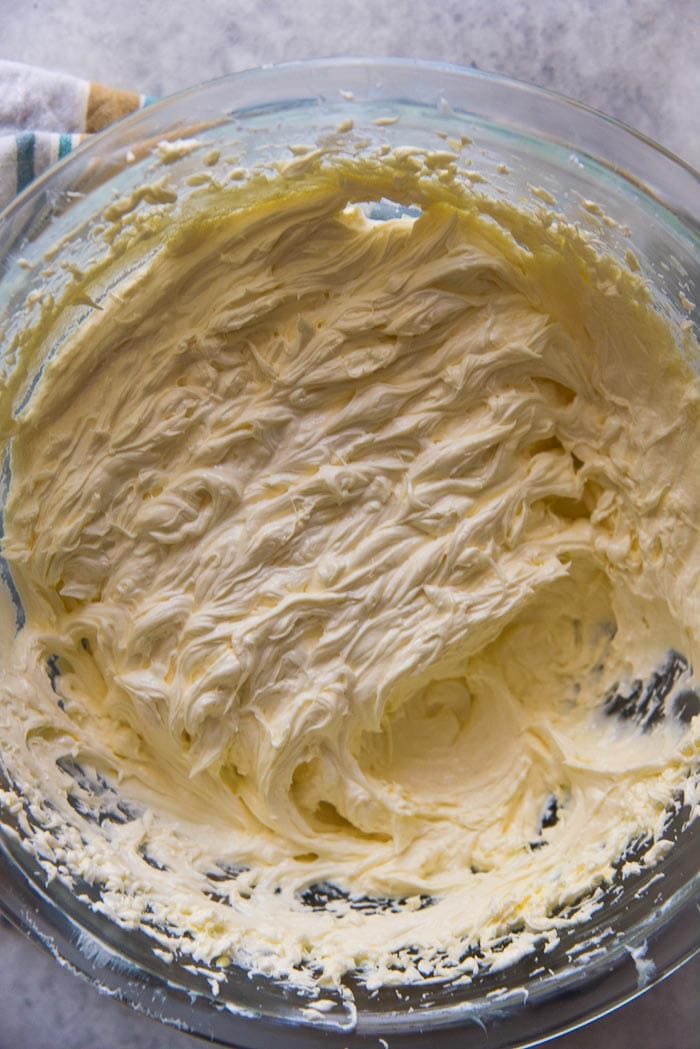 A bowl of creamed butter and sugar with the eggs mixed in. The flavoring has been added to this as well. 