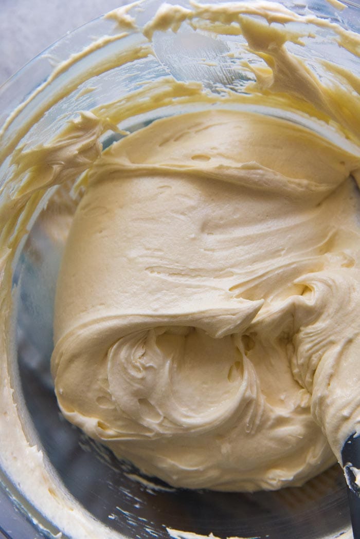 The bowl of cake batter with all the flour added, and completely smooth (no flour lumps), ready to be placed into cake pans. 