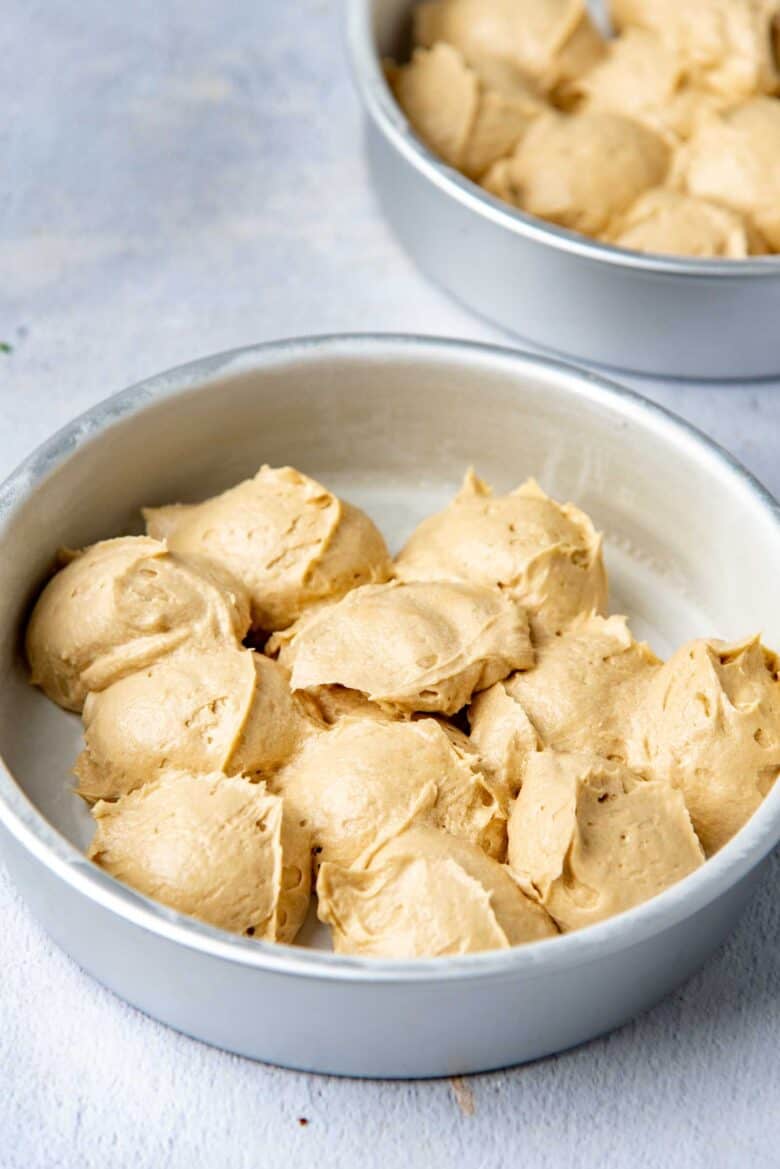 Dividing the cake batter using a scoop