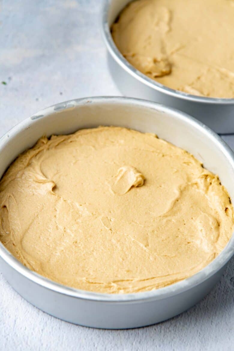The cake batter spread evenly in the cake pans