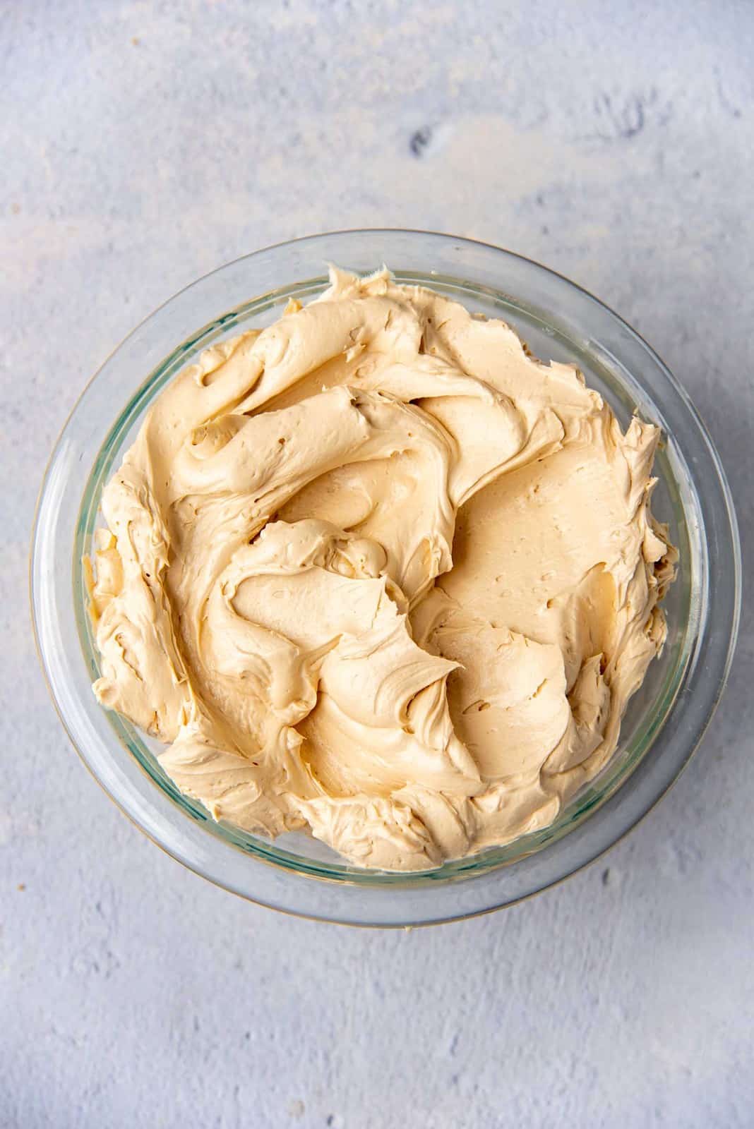 Coffee flavored buttercream in a glass bowl