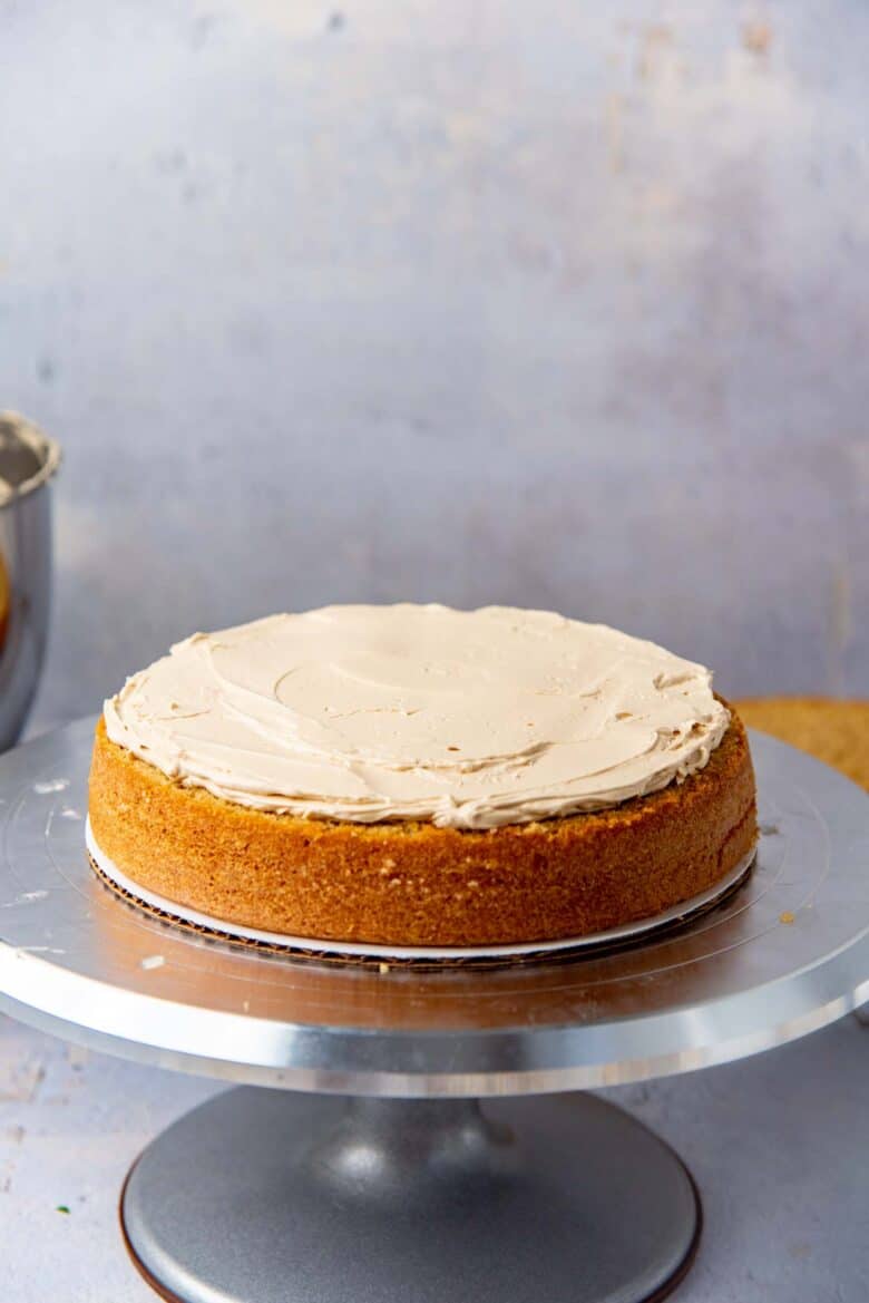 The buttercream spread in an even layer