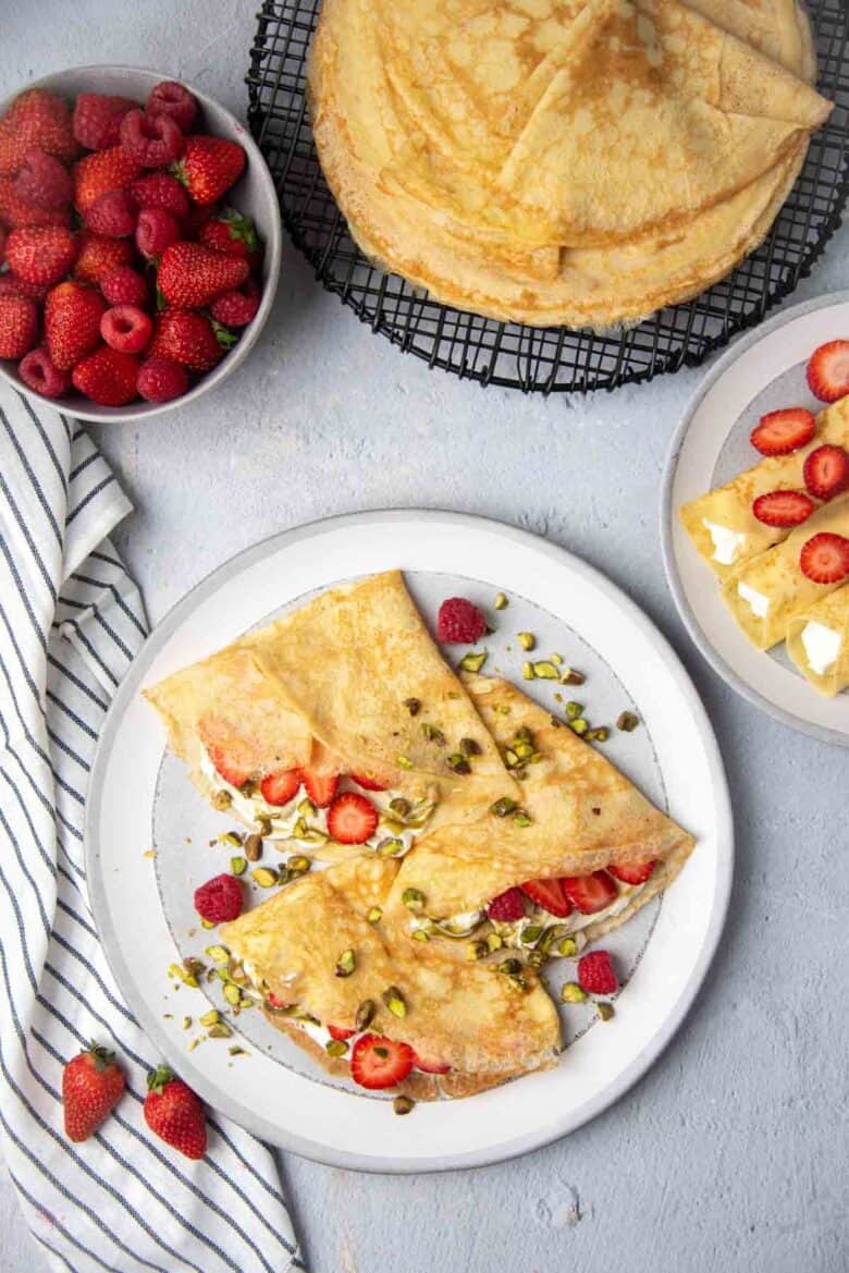 Overhead view of strawberry and cream crepes