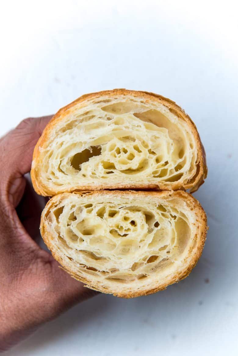 Cross section of a perfectly baked French croissant showing the honeycomb crumb.