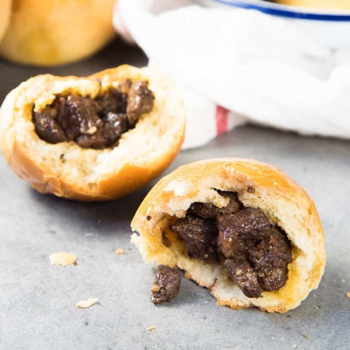 Sri Lankan Curried Beef buns - These Sri Lankan meat buns are so versatile and flavorful. Pillowy bread stuffed with curried beef. Great on the go breakfast idea, lunch or snack. 