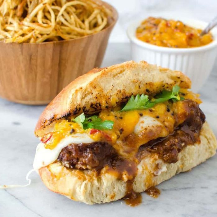 Curry Chicken Meatball Sandwich - Take your Meat Ball Subs to the next level with these Chicken meatballs made from scratch in a delicious spicy curry sauce and served in rolls with melted cheese and a cold, sweet and spicy mango chutney.