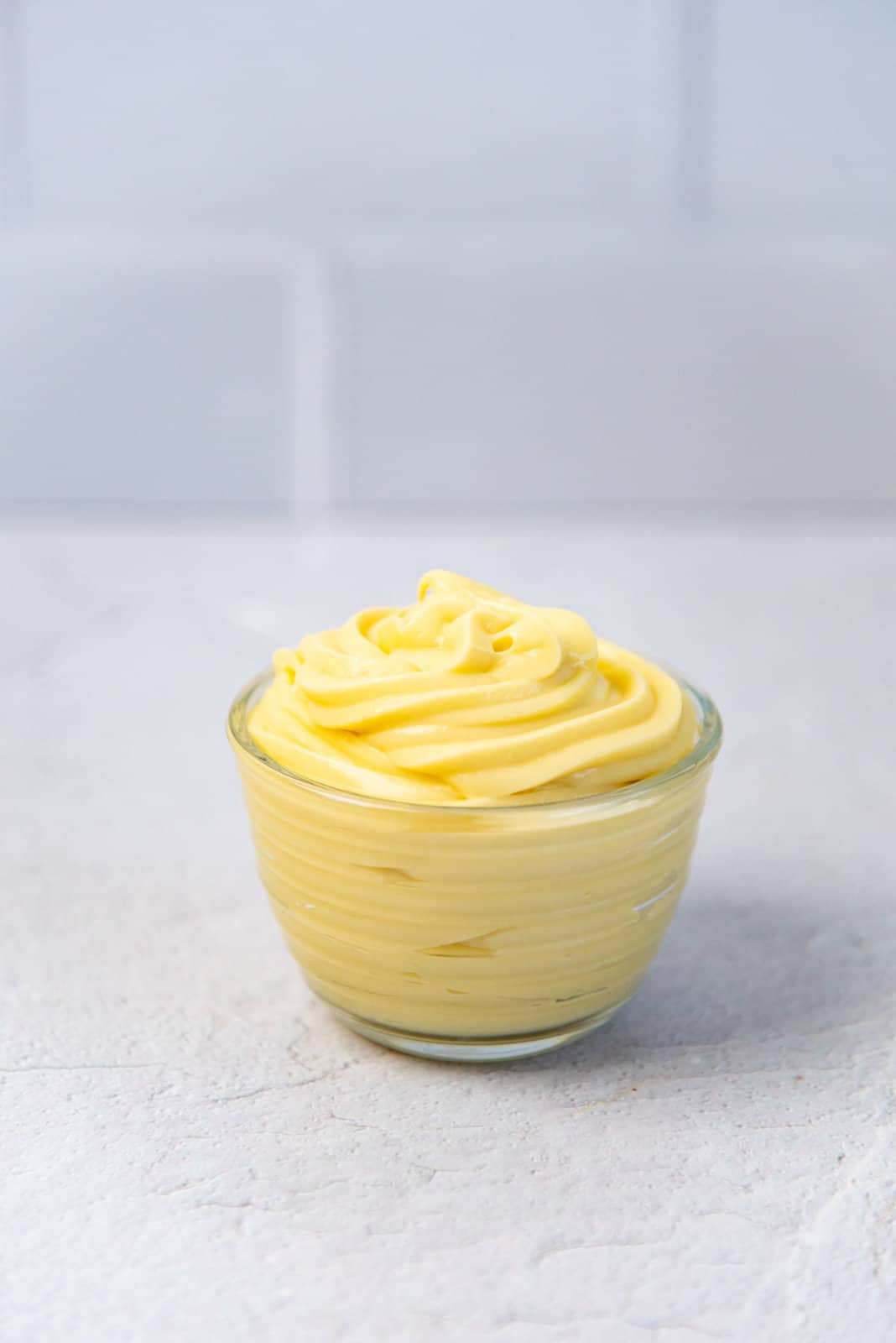 Pastry cream piped into a small bowl.