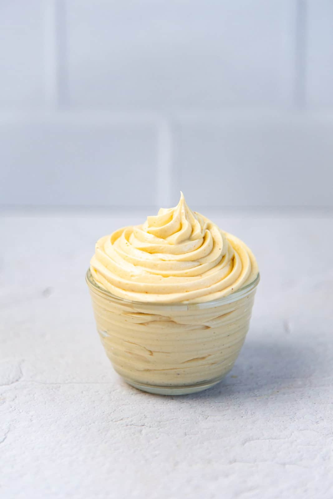 Creme Mousseline piped into a small bowl.