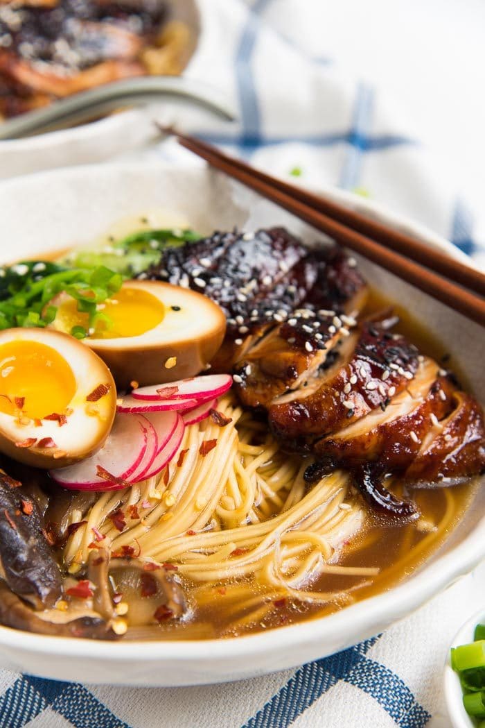 A close up of the bowl of ramen, showing the shoyu ramen broth. 