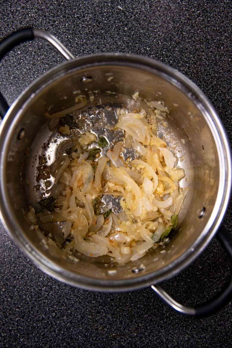 Softening the onions with garlic and other aromatics in a pot
