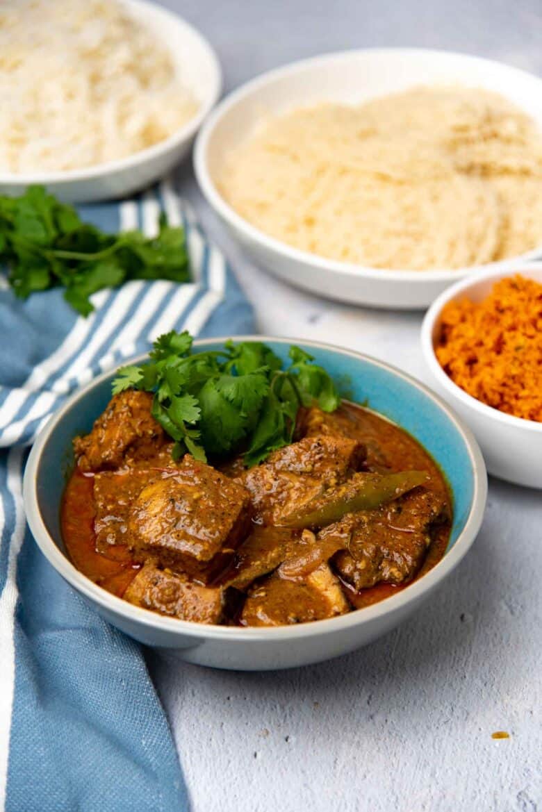 Spicy fish curry made with coconut milk served in a bowl