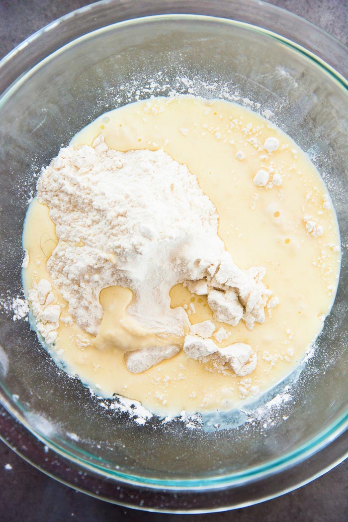 Half of the liquid has been added to the flour. By mixing this, it will create a lump free batter.