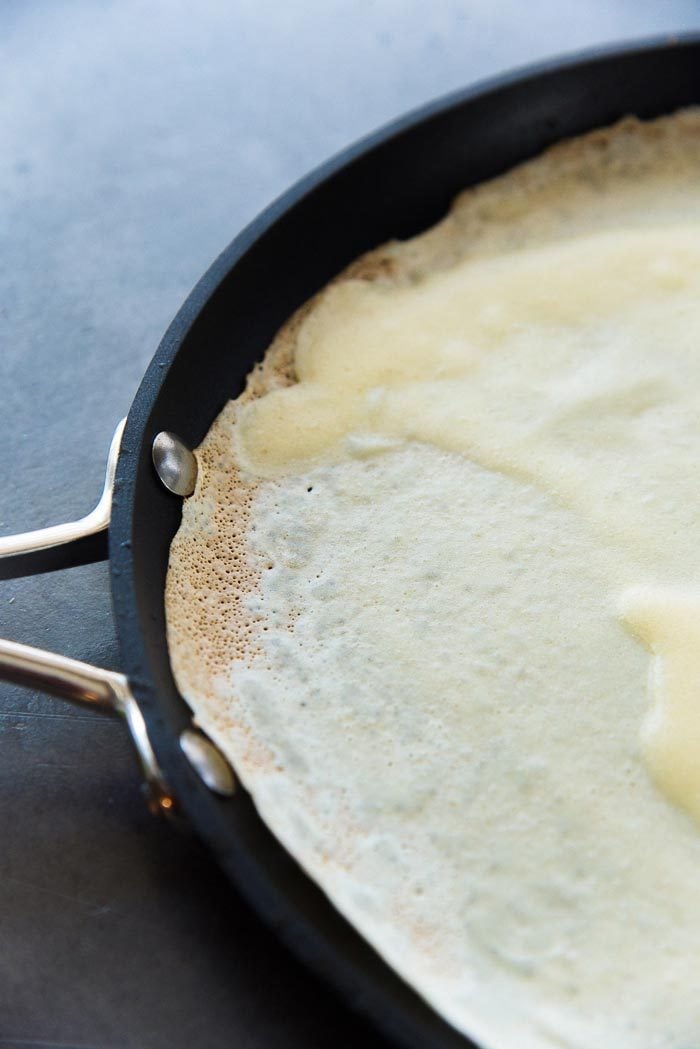 For basic crepes, wait for the edges to brown and crisp up slightly. Then it's ready to flip over (or ready to eat). 