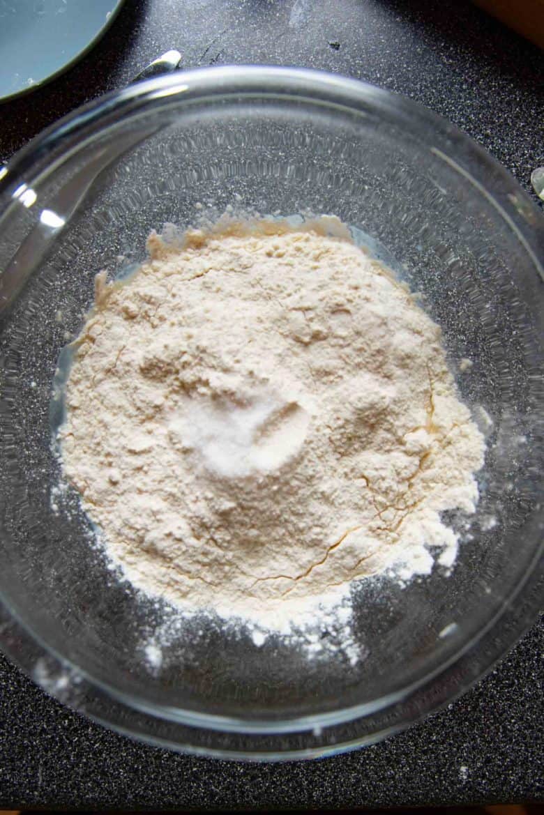 Adding the rest of the ingredients to the activated yeast.
